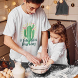 A Teenage in a Tolerable Thursday White Unisex Cotton T-shirt baking with his sister