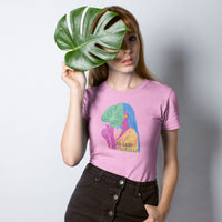 Woman holding a giant leaf wearing Be Leaf in Yourself Light Pink Unisex Cotton T-shirt